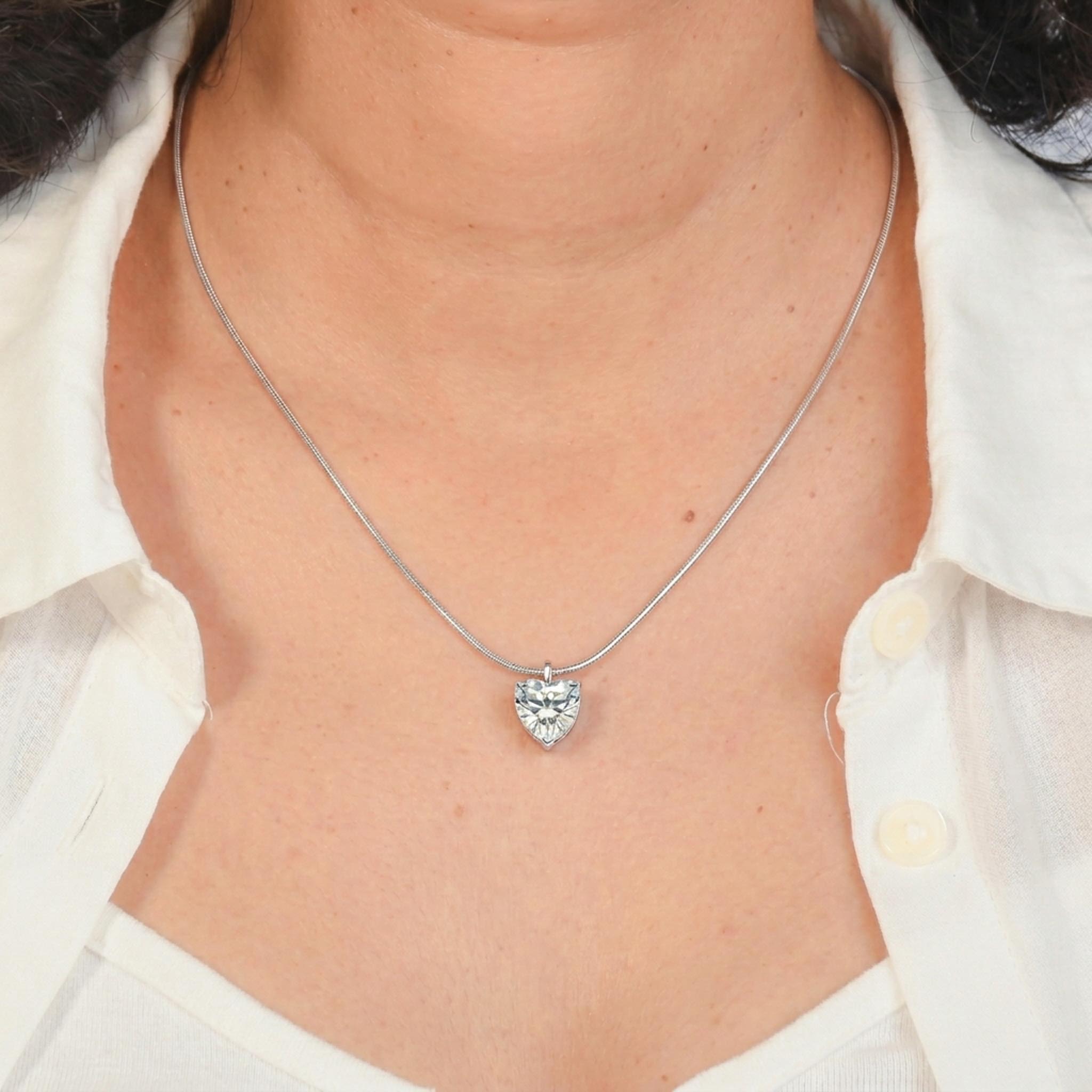 Crystal Heart 925 sterling silver necklace featuring a brilliant heart-cut crystal pendant suspended from a sleek sterling silver snake chain