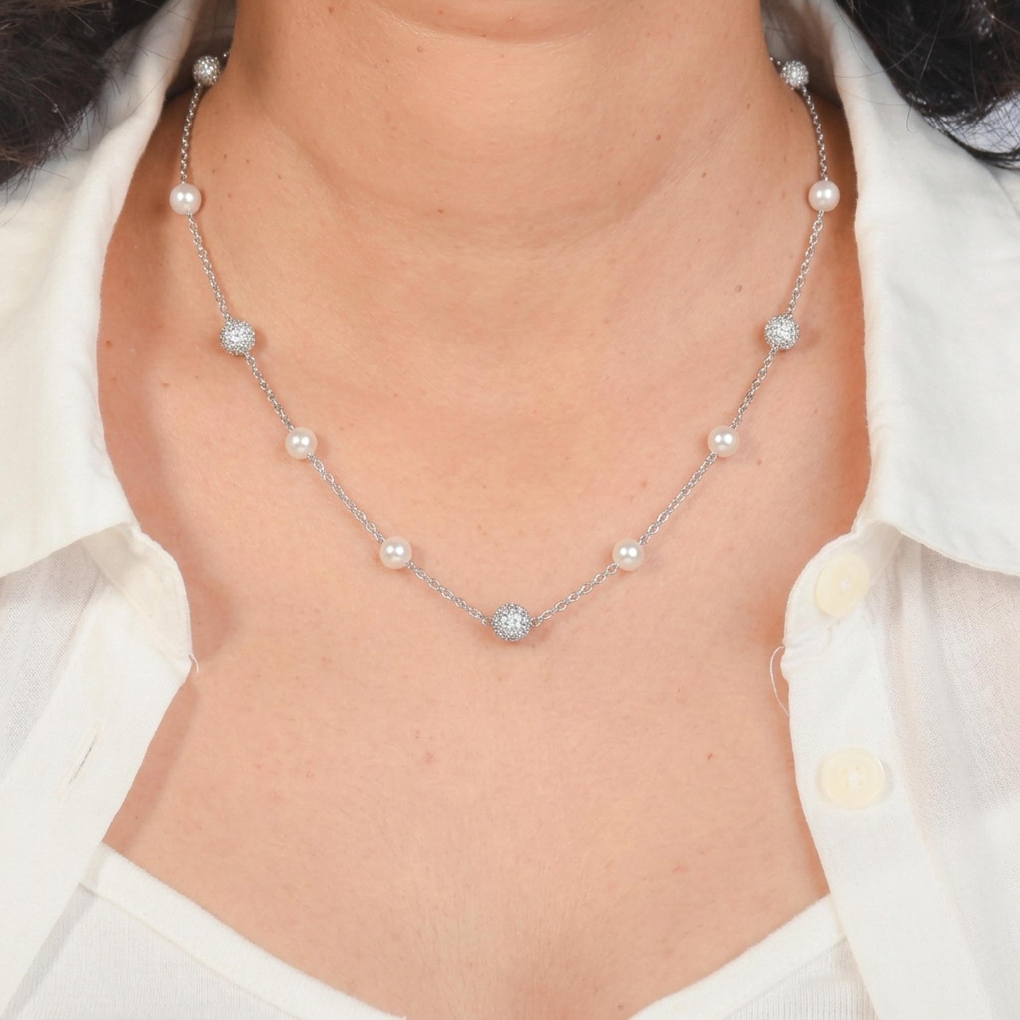 Pearl Stardust 925 sterling silver necklace featuring luminous pearl accents and sparkling pave crystal sphere charms delicately spaced along a fine silver chain