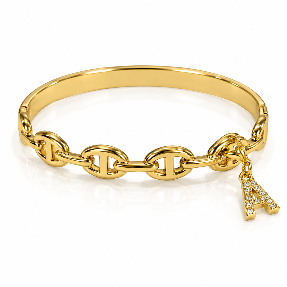 Gold-tone chain-link bangle bracelet with a smooth band and interlocking oval links, featuring a dangling rhinestone-encrusted letter “A” charm, displayed on a white background.