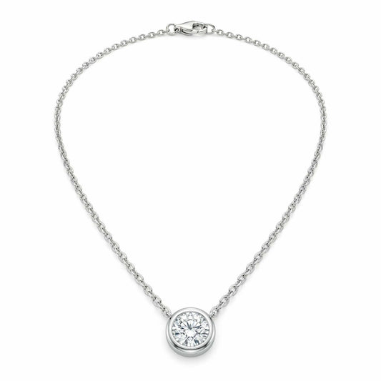 Silver solitaire pendant necklace featuring a round-cut crystal in a bezel setting on a delicate chain, displayed on a white background