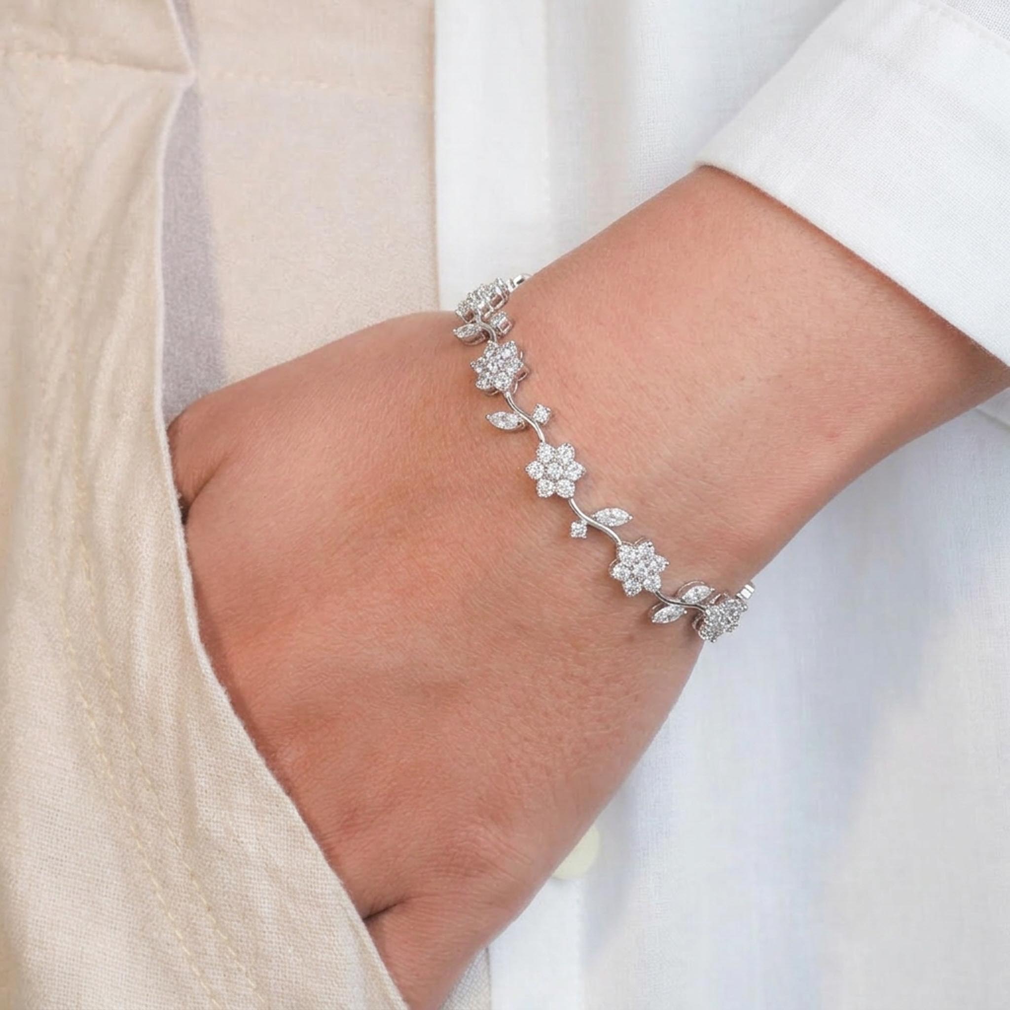 Blooming Vine 925 Sterling Silver Bracelet featuring delicate flower and leaf motifs adorned with sparkling pave-set stones, gracefully linked in a vine-inspired design
