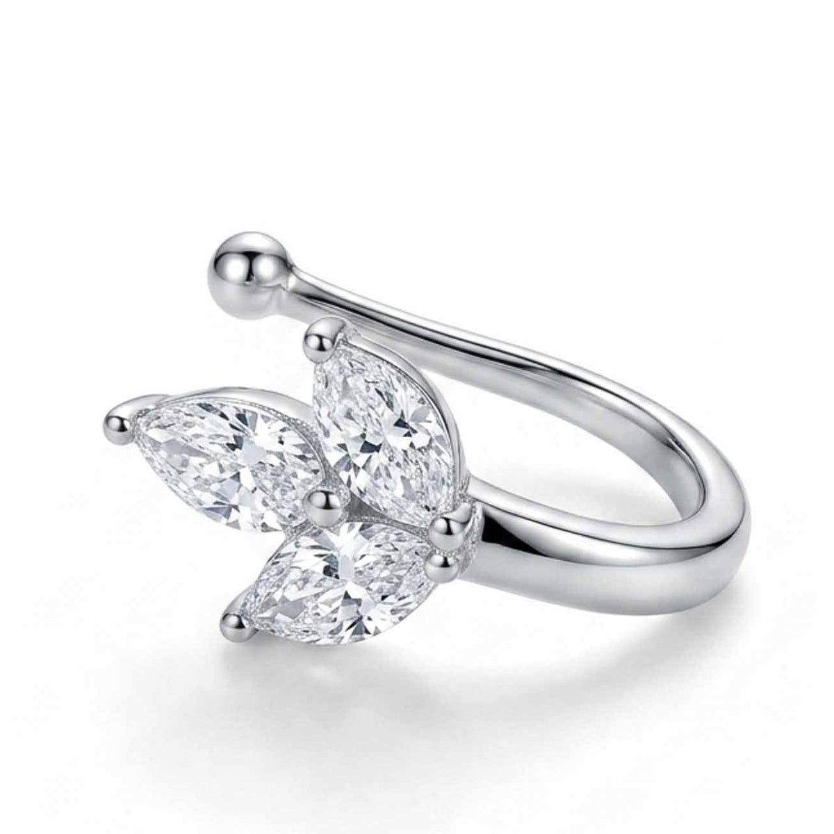 A studio product photograph of a polished silver-toned nose pin featuring a delicate cluster of three marquise-cut crystal stones arranged in a floral leaf motif against a clean white background.