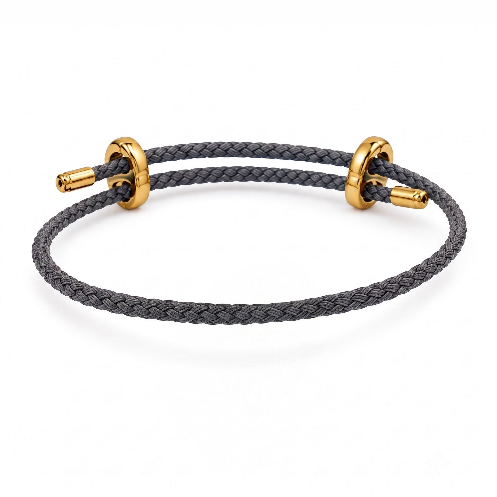 Braided dark grey cord bracelet with gold-tone sliding rings and end caps on a white background.