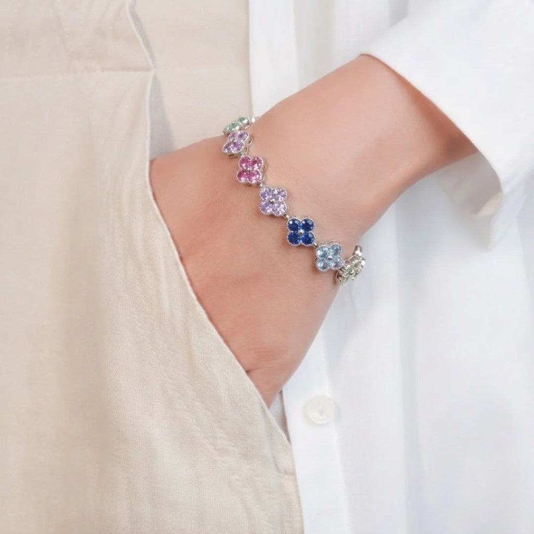 Women’s multi-color clover tennis bracelet with vibrant stones in gold-tone finish