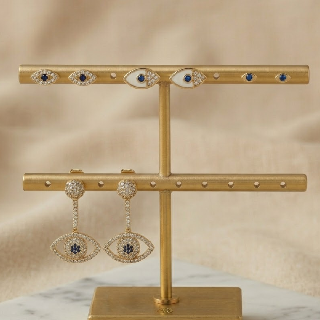 gold evil eye earring stack with dainty evil eye studs and celestial eye drop earrings lightweight stackable jewellery