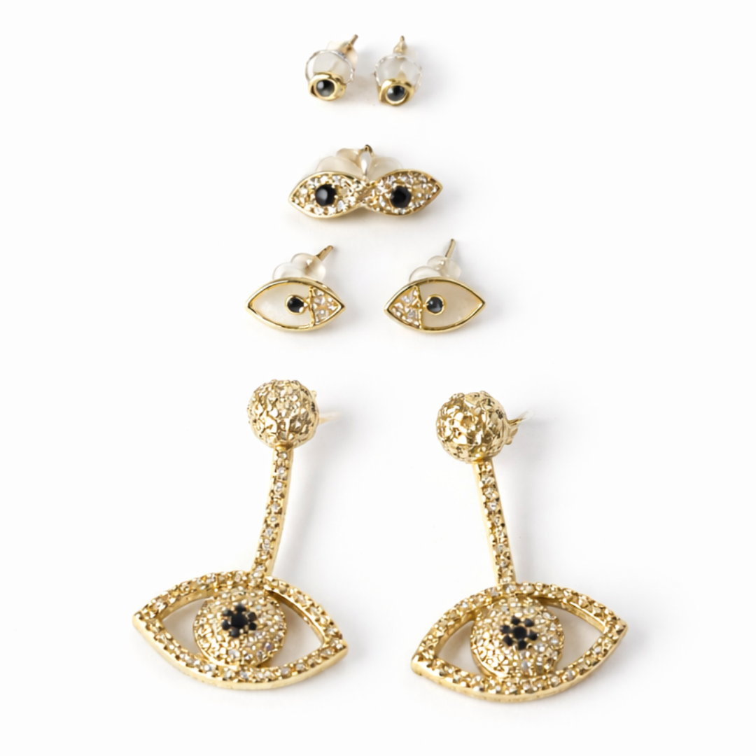 gold evil eye earring stack with dainty evil eye studs and celestial eye drop earrings lightweight stackable jewellery