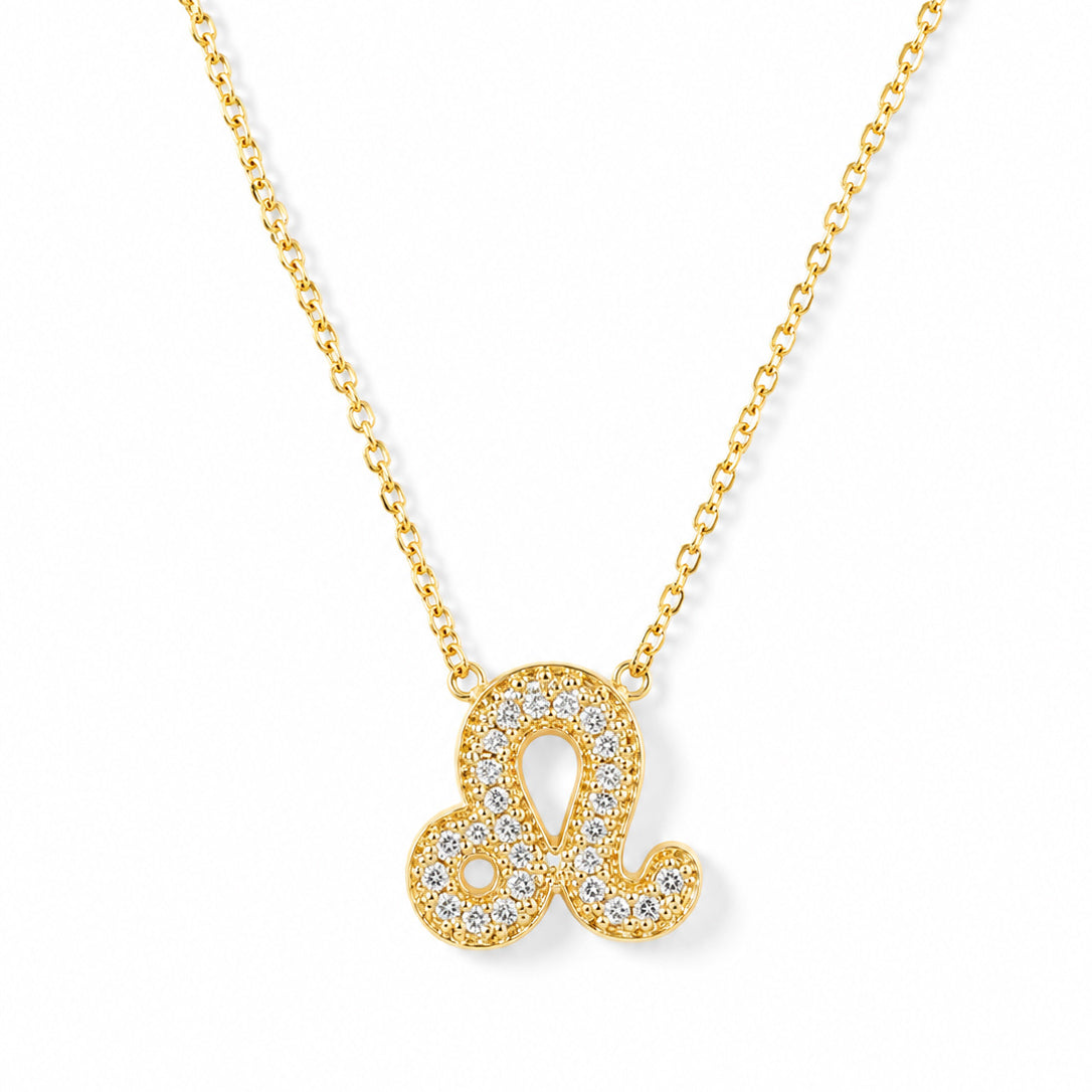 Gold-plated necklace featuring a sparkling Leo zodiac-inspired pendant, crafted with clear crystal stones and set on a delicate gold chain, displayed against a clean white background.