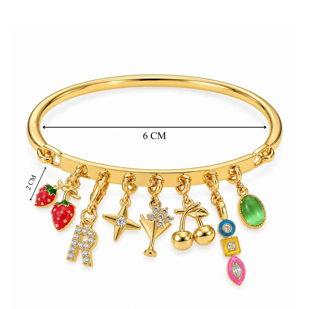 Gold-tone charm bracelet with a smooth cuff band and multiple dangling charms, including strawberries, a crystal-studded letter “R,” star, cocktail glass, floral charm, cherries, blue evil eye, green gemstone, and colorful geometric charms. The bracelet measures approximately 6 cm across, with the strawberry charm measuring about 2 cm, displayed on a clean white background.
