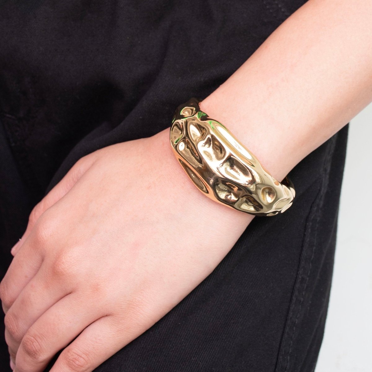 Bold golden abstract bangle with a sleek textured design and adjustable anti-tarnish finish, perfect for parties, events, and modern statement styling.