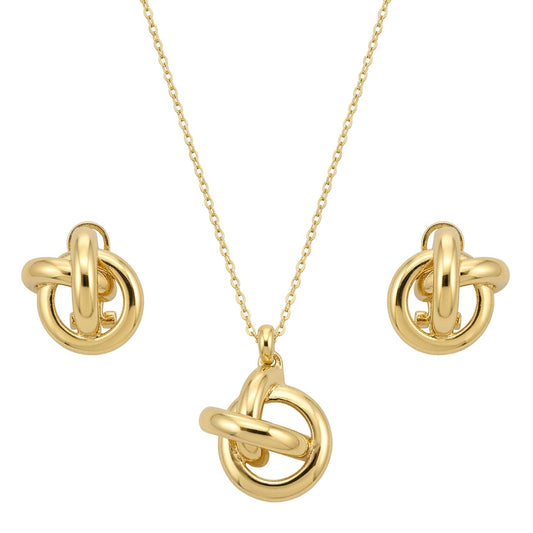 A coordinated gold-tone jewelry set featuring a necklace and matching stud earrings. The design showcases interlinked circular rings with a smooth, polished finish, creating a modern knot-like motif. The necklace has a delicate chain with a central pendant, while the earrings mirror the same interlocking ring design, all set against a clean white background.