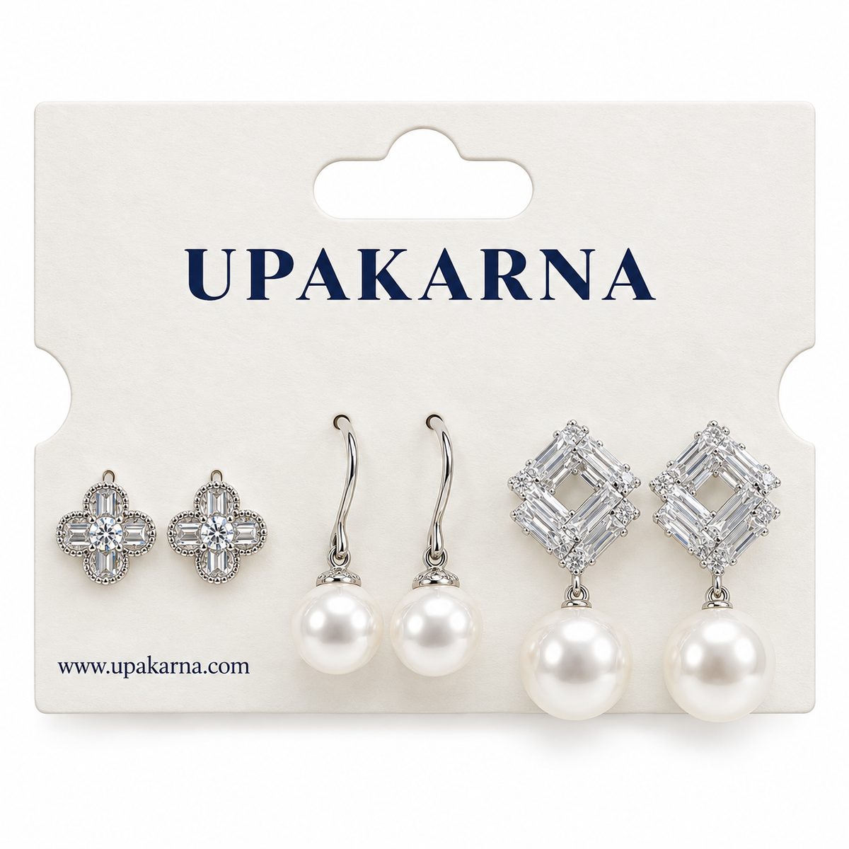 Silver earring set displayed on a white jewellery card, featuring crystal flower studs, pearl drop earrings, and geometric crystal pearl earrings.