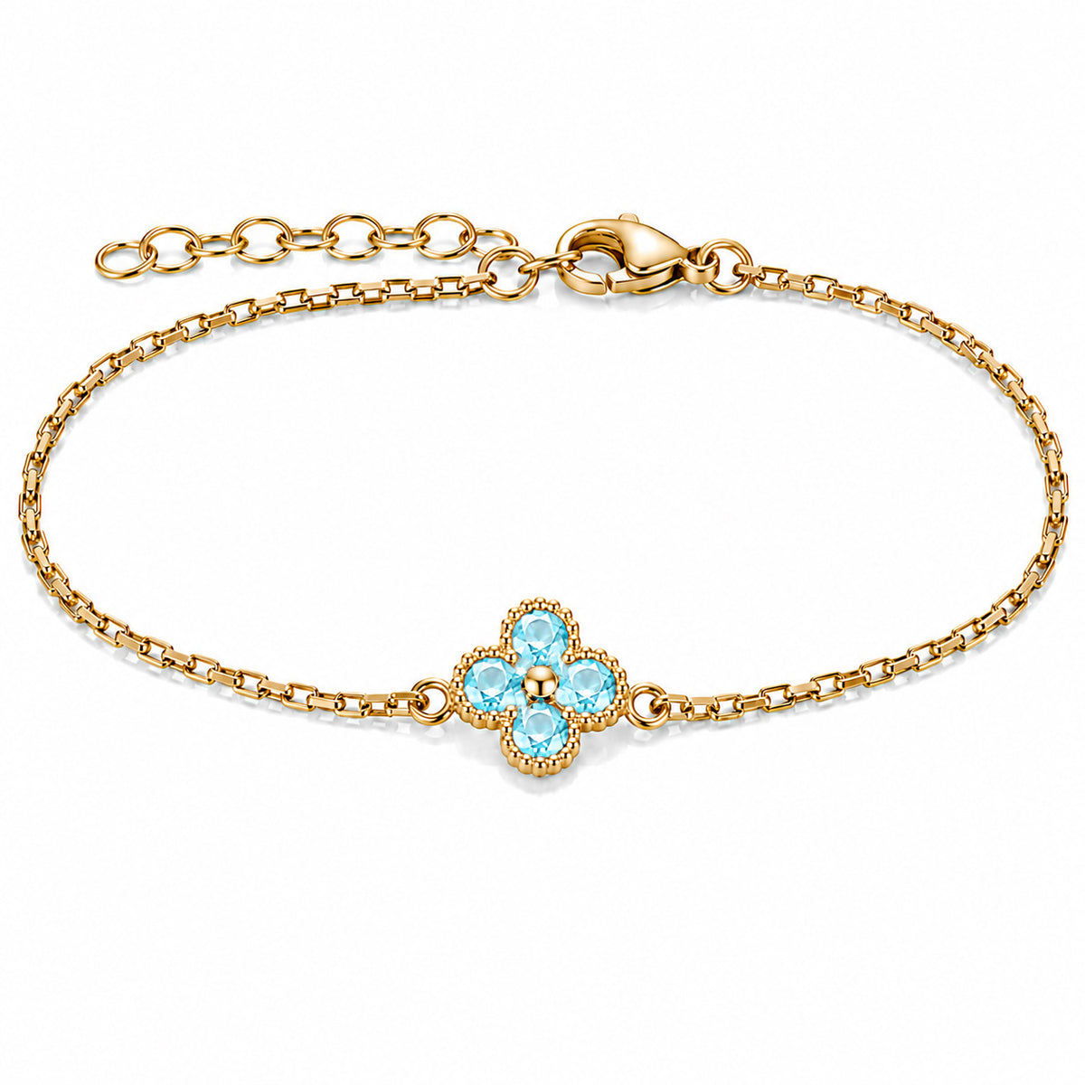 Gold-plated bracelet featuring a delicate four-leaf clover charm with four bright aqua-blue stones, set on a fine gold chain with an adjustable extension chain and lobster clasp, displayed against a clean white background.