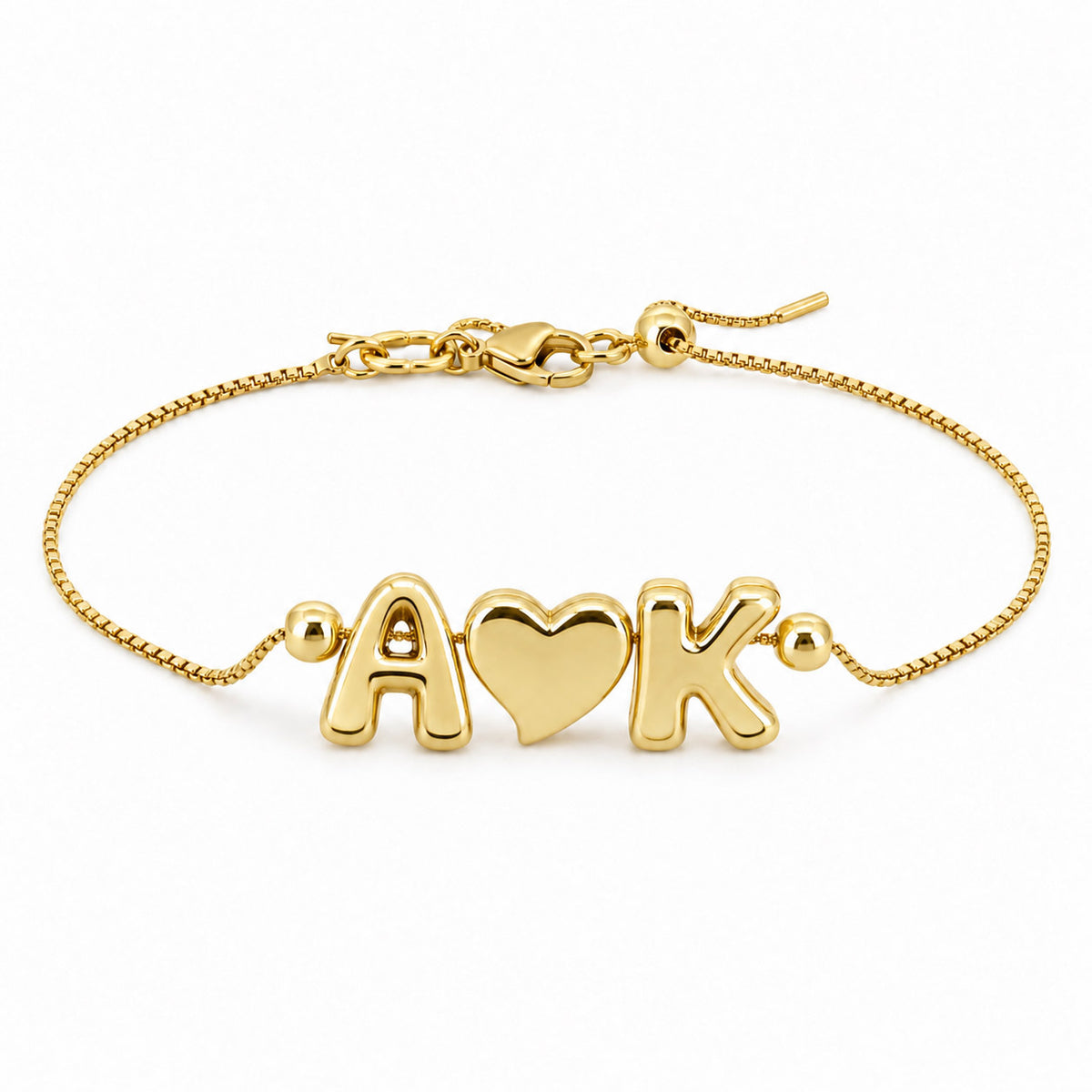 Gold-tone personalized bracelet featuring A♥K letter charms on a delicate adjustable chain, displayed on a clean white background.