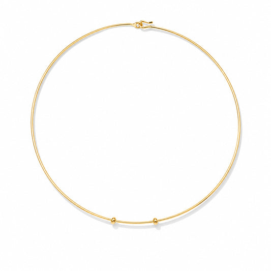 Minimal gold choker necklace with a delicate circular wire design and small bead accents on a white background.