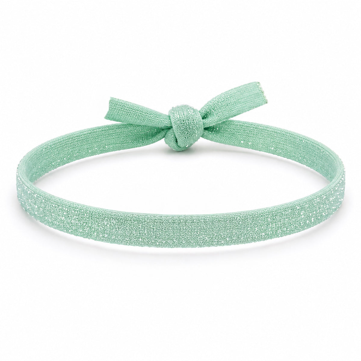 Mint green glitter bracelet with a matching fabric knot, displayed on a clean white background.