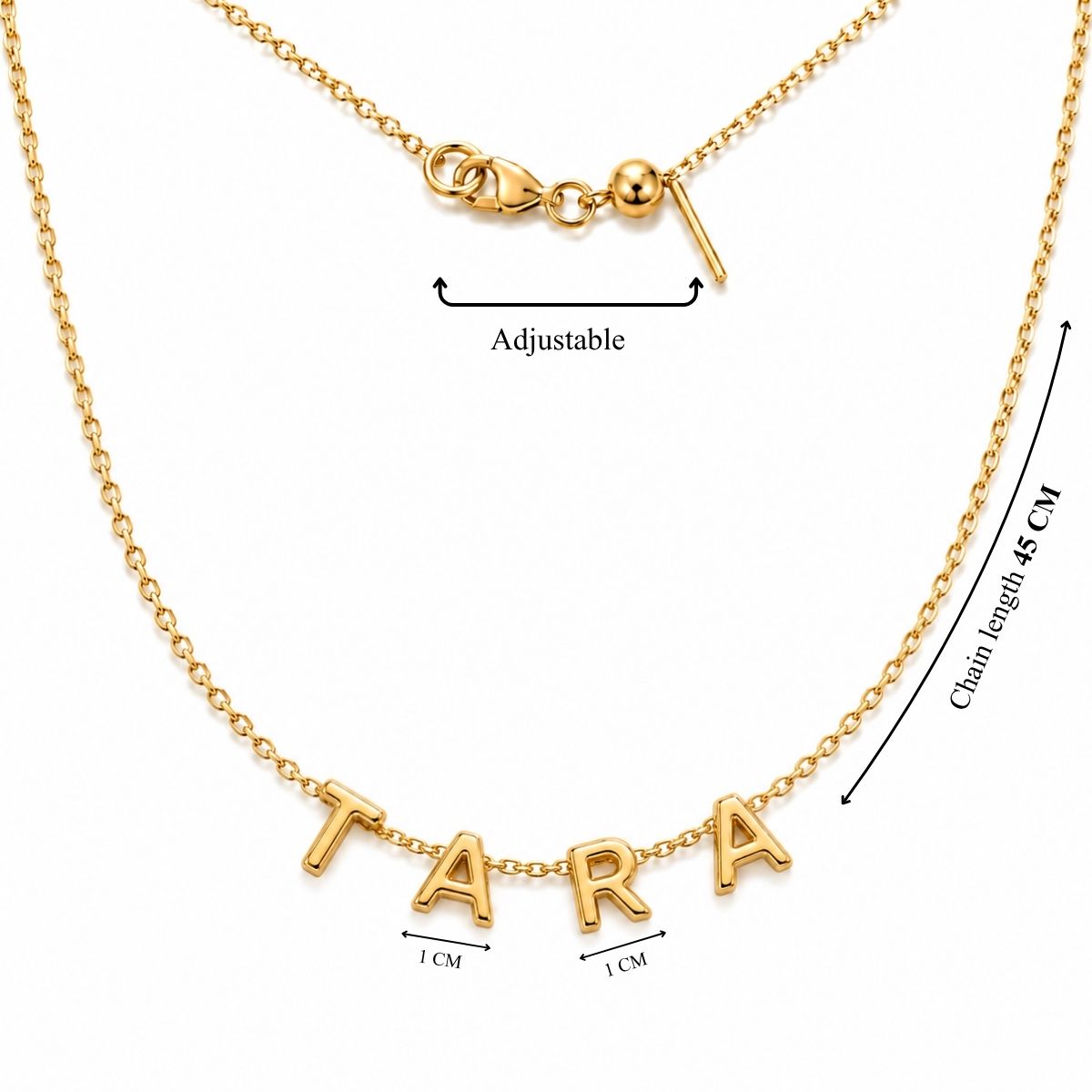 Product measurement image showing a gold chain necklace with a total length of 45 cm, an adjustable slider mechanism, and 1 cm tall polished gold letter pendants spelling out "TARA"