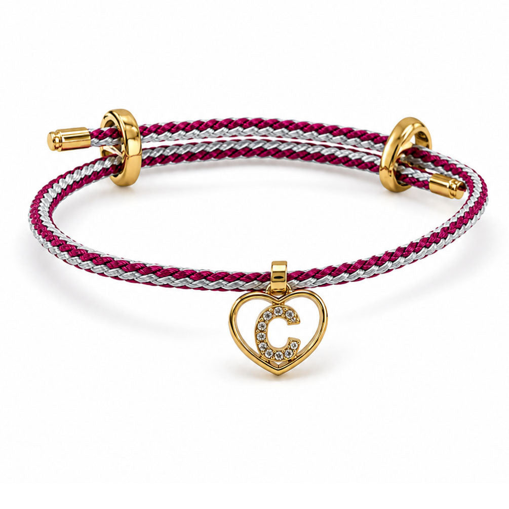 Brown braided adjustable bracelet on a clean white background, featuring a gold heart-shaped pendant with a sparkling letter C initial charm.
