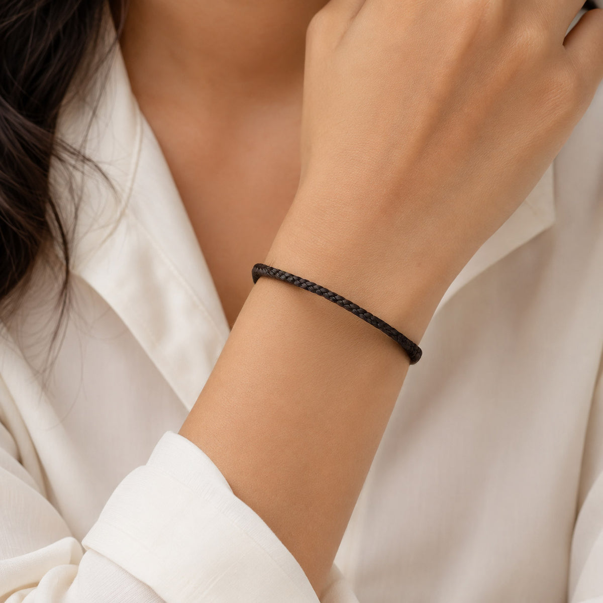 Yes, this is a plain dark brown braided bracelet cord without the charm. The clean, minimal look makes it perfect for adding personalised charms or wearing alone.