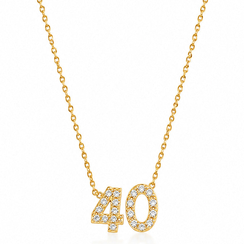 Gold-plated personalized number necklace featuring a sparkling pavé “40” pendant on a delicate gold chain, displayed against a clean white background.