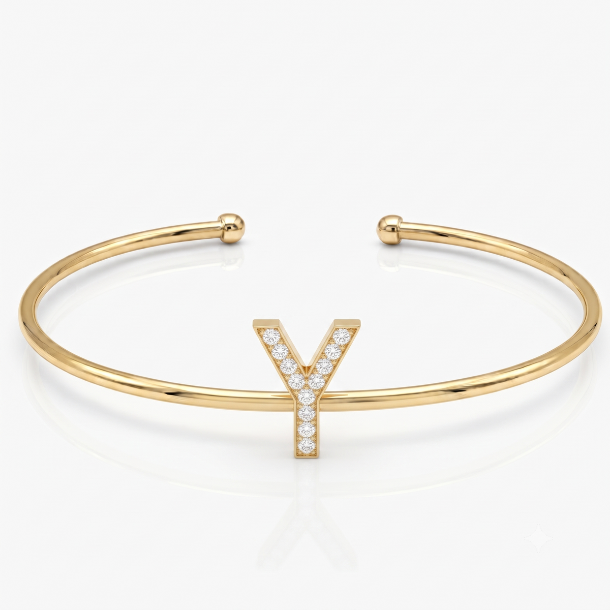 Elegant gold-tone adjustable open cuff bangle featuring a pavé crystal-studded letter Y centerpiece. The personalized initial bangle has a sleek polished finish with rounded ball ends and is displayed on a clean white background, making it perfect for everyday wear, stacking, gifting, and personalized jewellery collections.