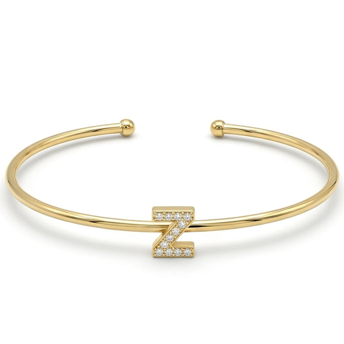 Elegant gold-tone adjustable open cuff bangle featuring a pavé crystal-studded letter Z centerpiece. The personalized initial bangle has a sleek polished finish with rounded ball ends and is displayed on a clean white background, making it perfect for everyday wear, stacking, gifting, and personalized jewellery collections.