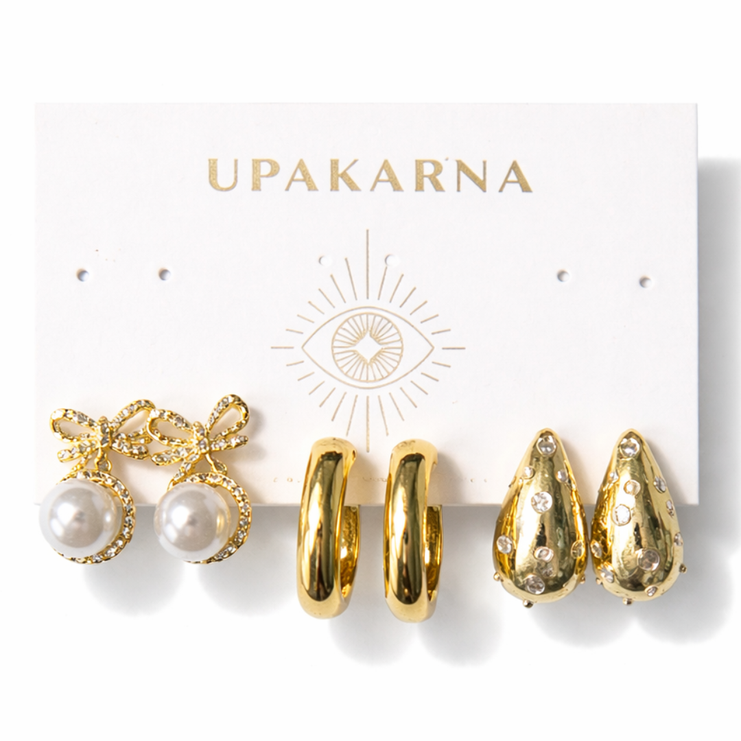 gold pearl earring stack with bow earrings, pearl hoops and tear drop earrings elegant lightweight jewellery