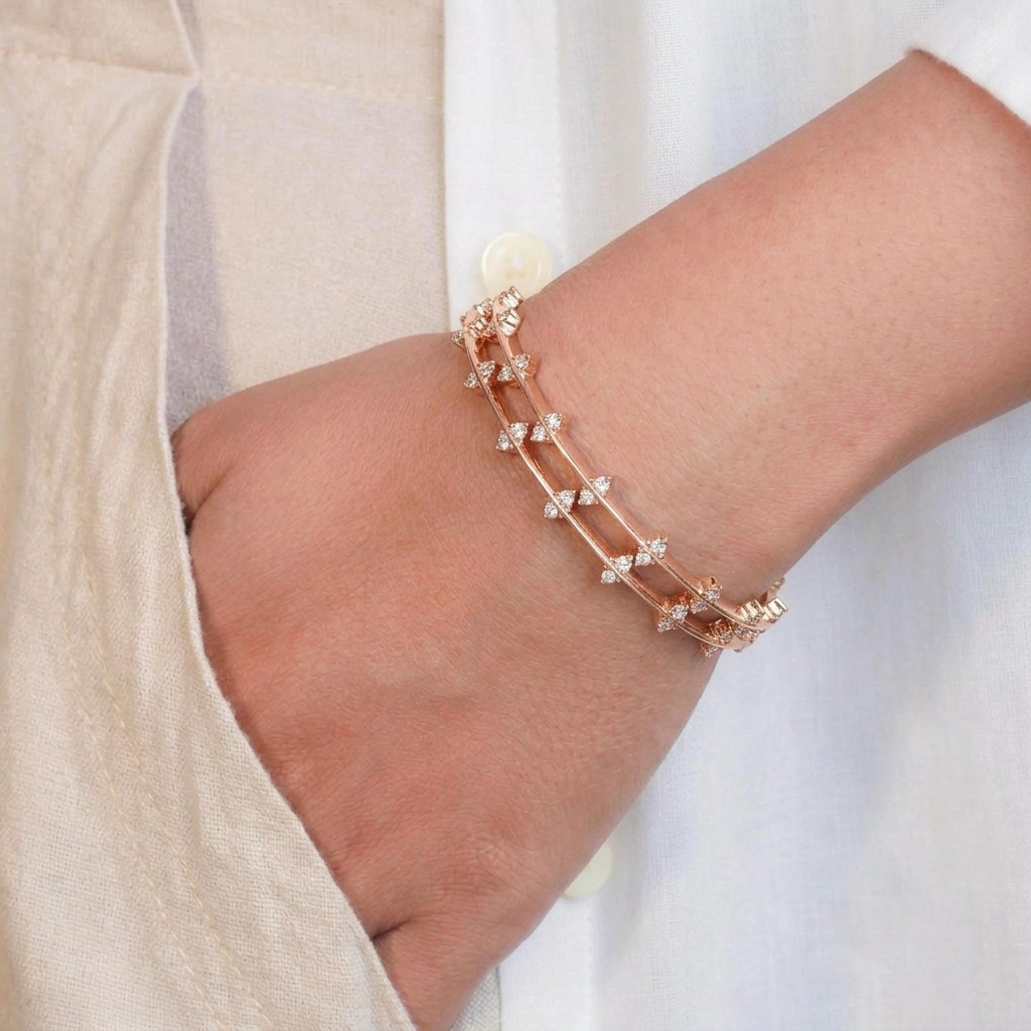 Diamond Crest Bangles featuring sparkling crystal stones in a timeless and elegant design.