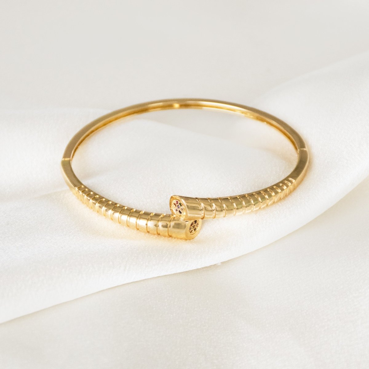 Elegant golden dual-design bangle with an anti-tarnish finish and openable clasp lock, perfect for everyday wear, casual styling, and effortless elegance.