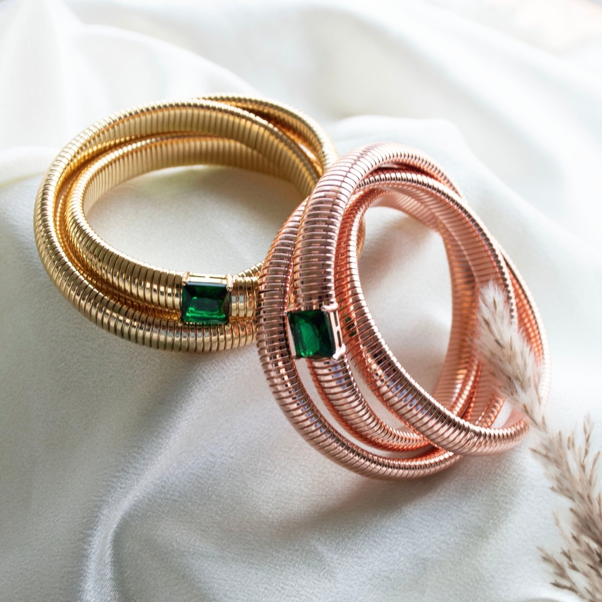 Elegant triple-layer bangles with vibrant emerald stone detailing and an anti-tarnish finish, perfect for party wear, casual elegance, and royal-inspired styling.