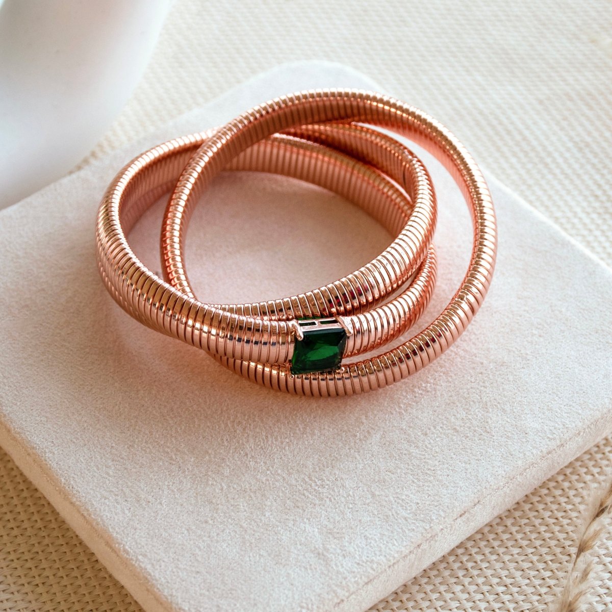 Elegant triple-layer bangles with vibrant emerald stone detailing and an anti-tarnish finish, perfect for party wear, casual elegance, and royal-inspired styling.