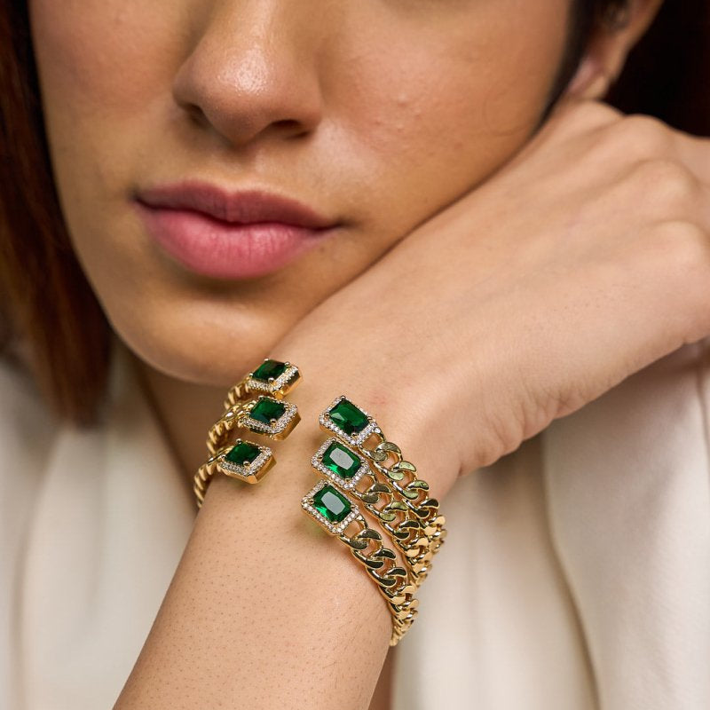 Elegant golden emerald loop bangle with a chic chain-link design and adjustable anti-tarnish finish, perfect for everyday elegance, special occasions, and stylish stacked looks.