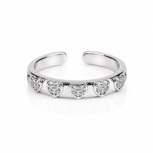 Delicate silver heart band ring with sparkling pavé crystals and an adjustable anti-tarnish finish, perfect for everyday elegance, stacking, and romantic styling.