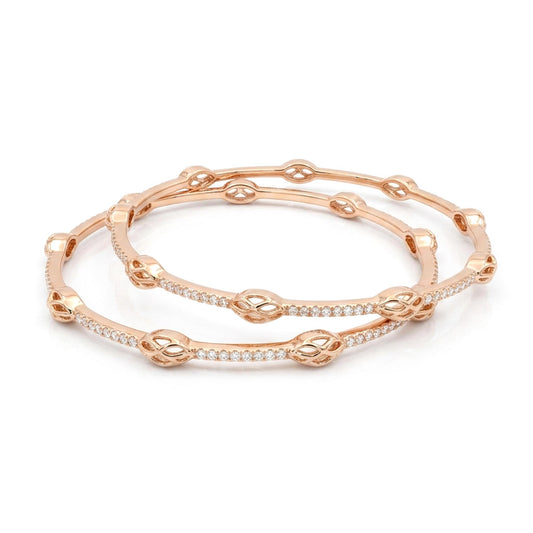 Rose gold bracelet with diamond accents on a white background
