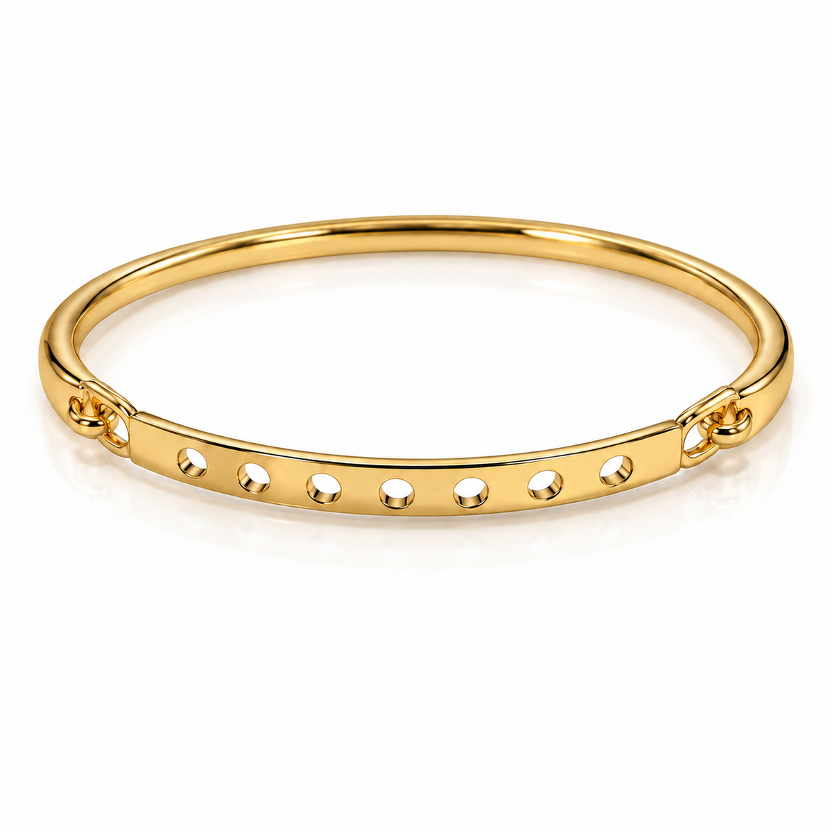 Gold-tone bangle bracelet with a smooth band and six evenly spaced circular cutouts, displayed on a clean white background.