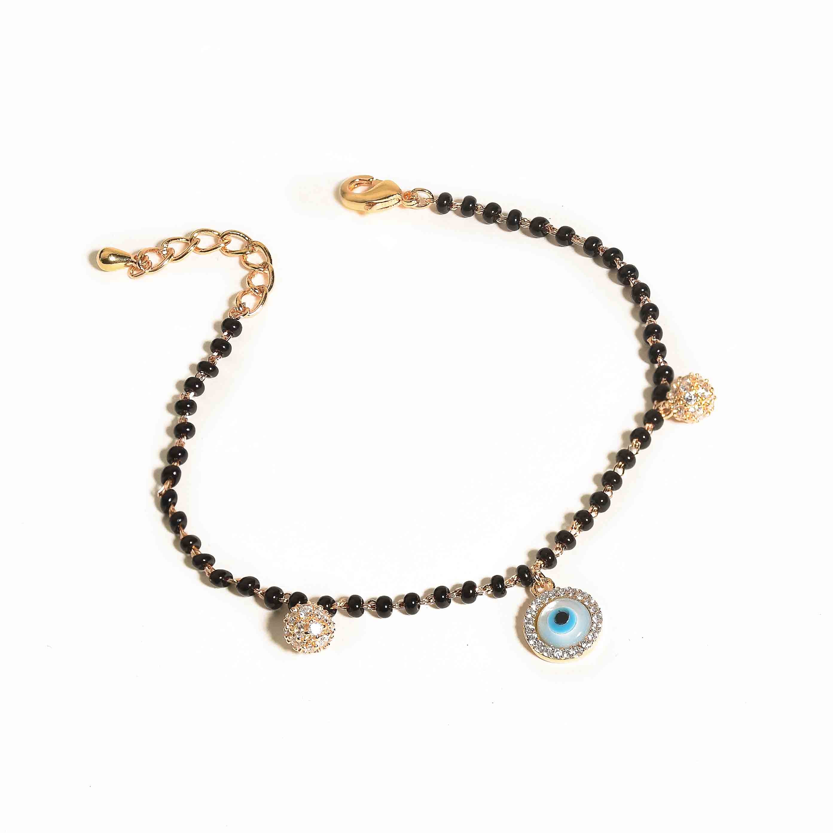 Evil eye mangalsutra bracelet with protective charm detailing and an anti-tarnish gold finish, perfect for everyday wear and meaningful styling.