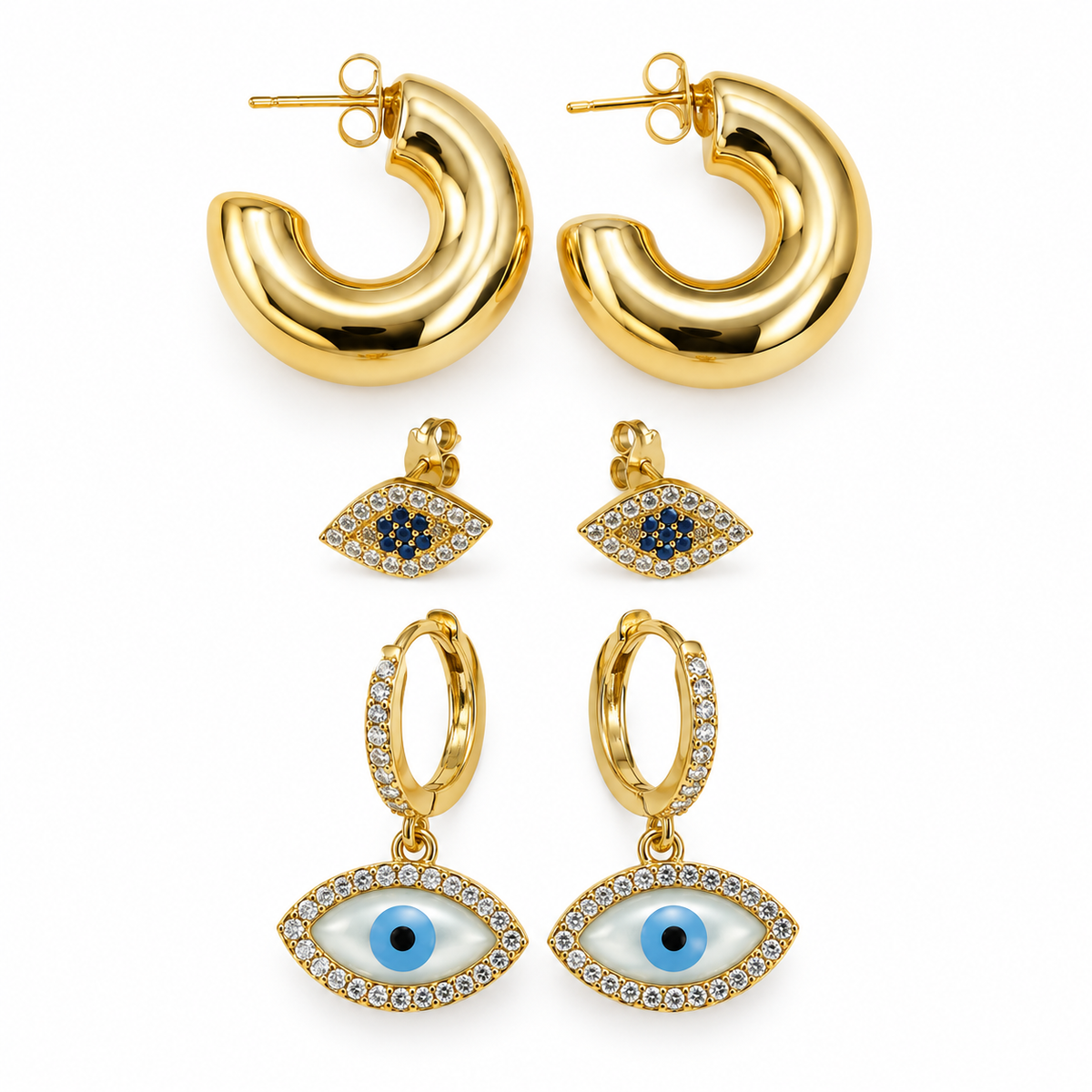 Three pairs of gold-tone earrings displayed on a white background, featuring chunky hoops, blue Evil Eye studs, and crystal Evil Eye drop earrings.