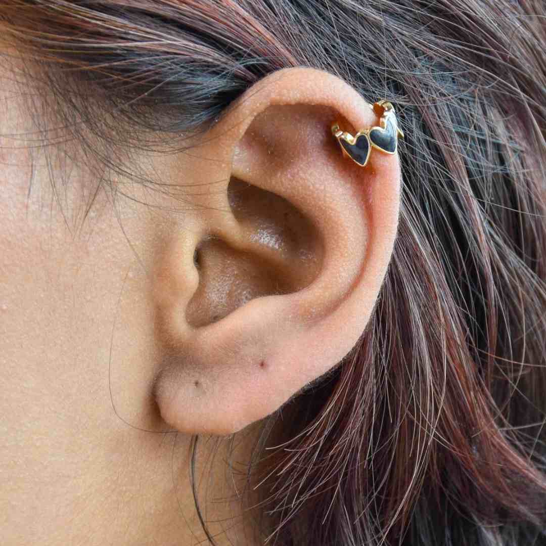 Heart ear cuffs with colorful enamel detailing and an anti-tarnish gold finish, perfect for everyday wear and playful styling.