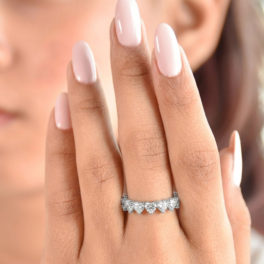 Romantic silver eternity ring featuring heart-shaped stones in a continuous anti-tarnish alloy band, symbolizing everlasting love with radiant sparkle, perfect for anniversaries, weddings, and vow renewals
