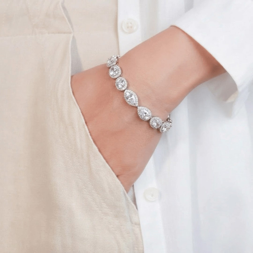 Imperial Sparkle tennis bracelet with multi-cut stones and pavé halo detailing in a polished metal finish