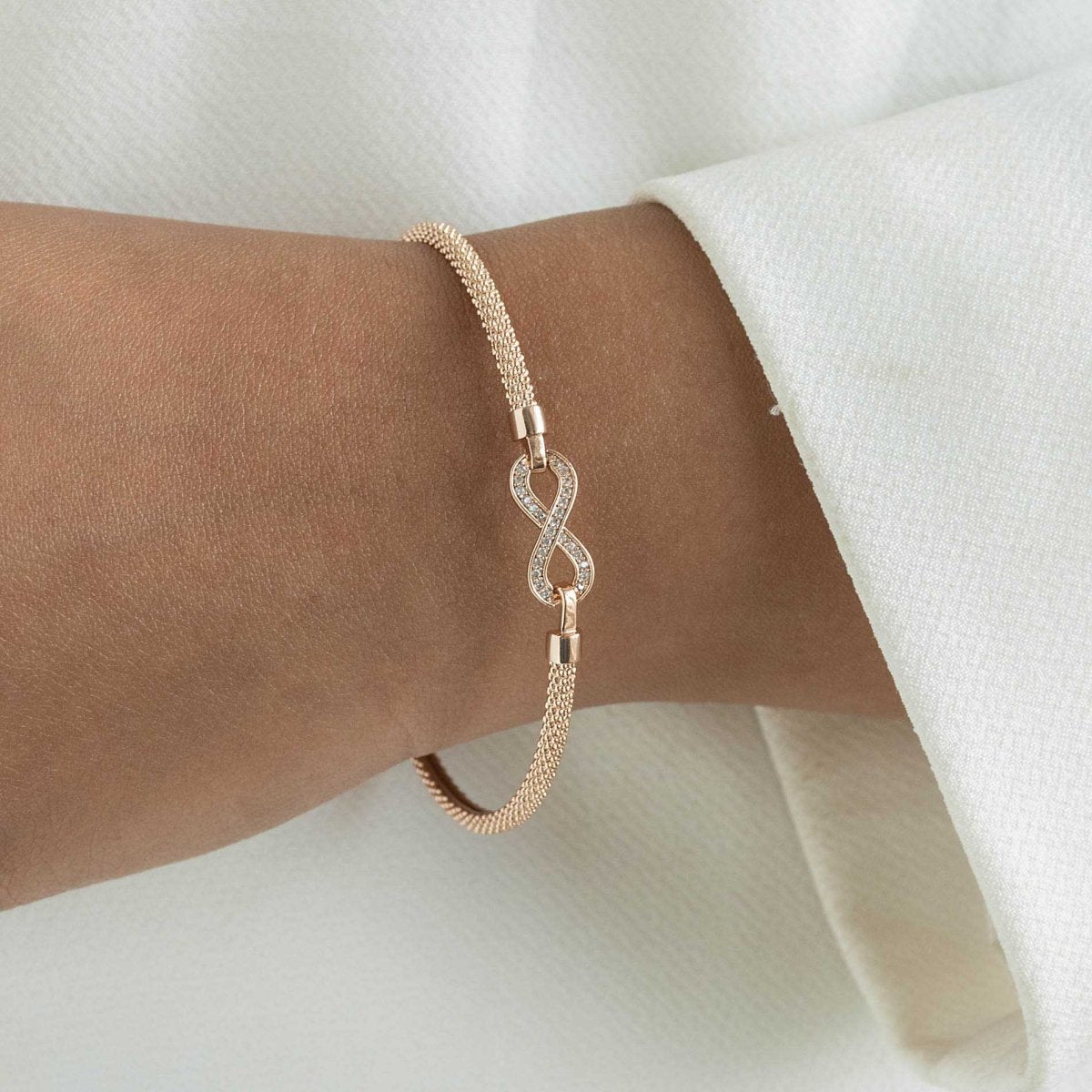 Infinity bangle with a sleek infinity motif and anti-tarnish finish, available in gold, rose gold, and silver, perfect for everyday wear, meaningful gifting, and timeless styling.