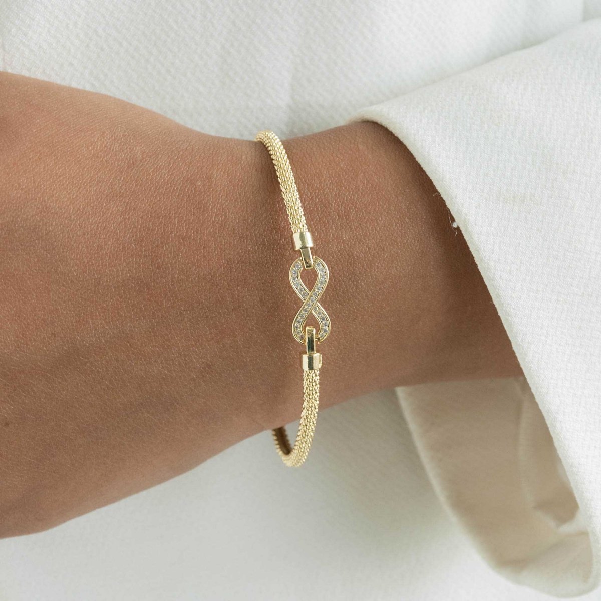 Infinity bangle with a sleek infinity motif and anti-tarnish finish, available in gold, rose gold, and silver, perfect for everyday wear, meaningful gifting, and timeless styling.