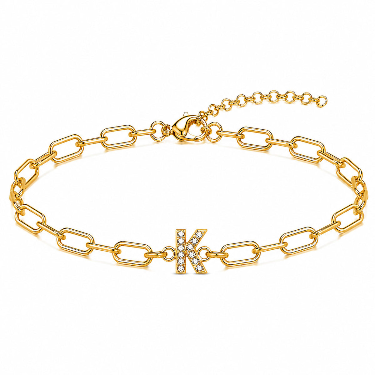 Gold-tone chain bracelet with elongated oval links, a sparkling letter “K” charm, lobster clasp, and adjustable extender chain, displayed on a clean white background.