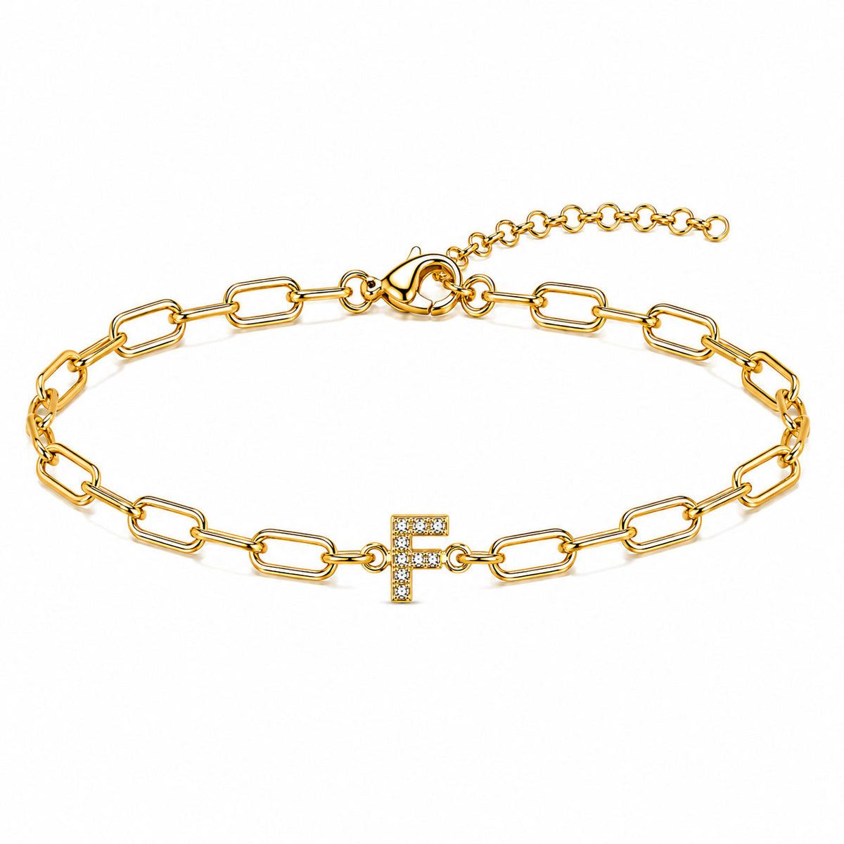 Gold-tone chain bracelet with elongated oval links, a sparkling letter “F” charm, lobster clasp, and adjustable extender chain, displayed on a clean white background.