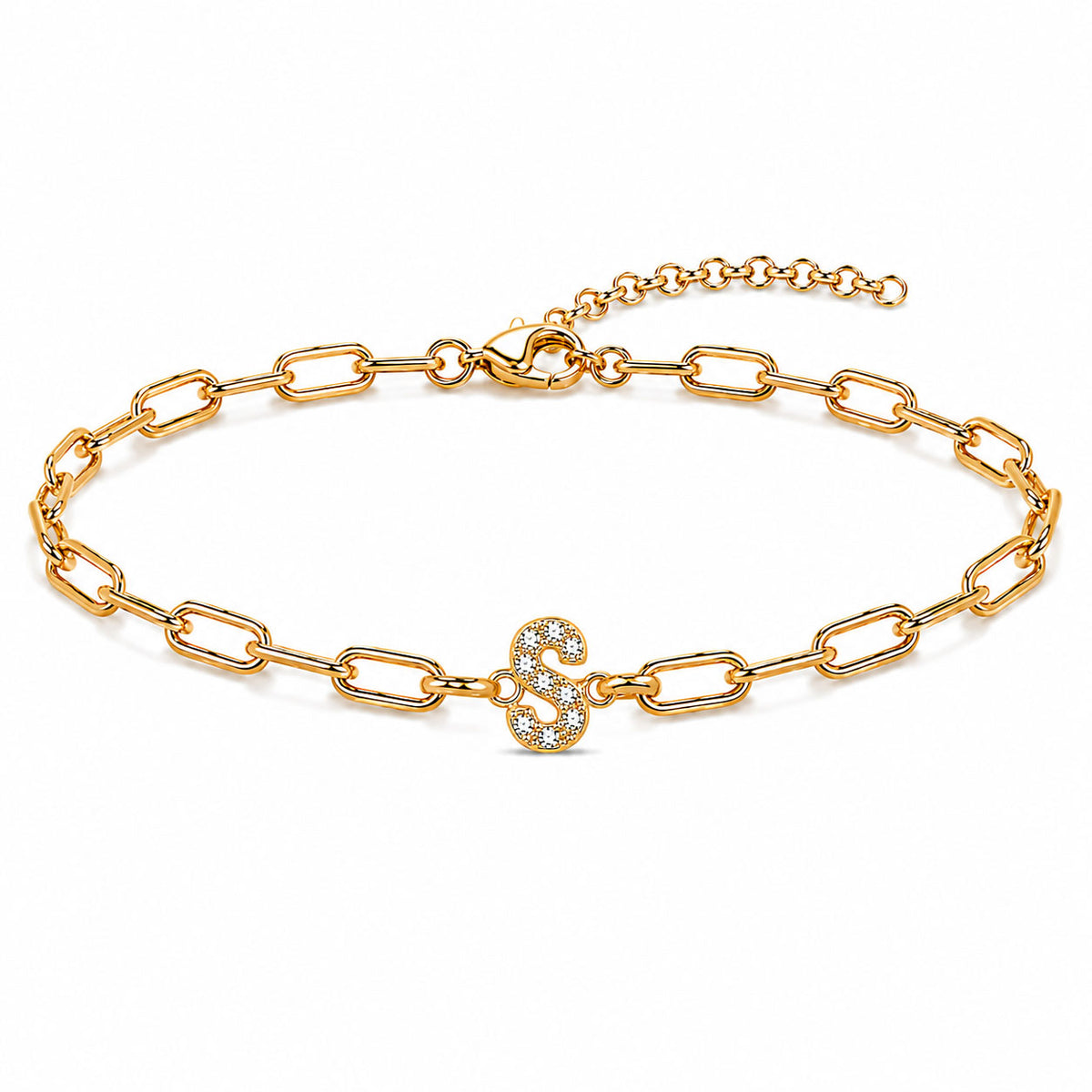 Gold-tone chain bracelet with elongated oval links, a sparkling letter “S” charm, lobster clasp, and adjustable extender chain, displayed on a clean white background.