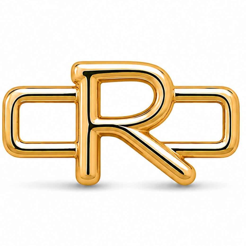 A polished gold-tone letter “R” charm with a glossy, reflective finish, featuring a bold uppercase A design integrated with a rectangular open-link frame. The charm has smooth rounded edges, a modern minimalist style, and a bright metallic surface, displayed against a clean white background.