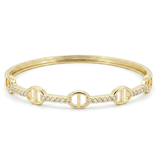 Anti-tarnish yellow gold hinged bangle bracelet featuring alternating mariner anchor link stations and pavé cubic zirconia segments, set against a solid white background.