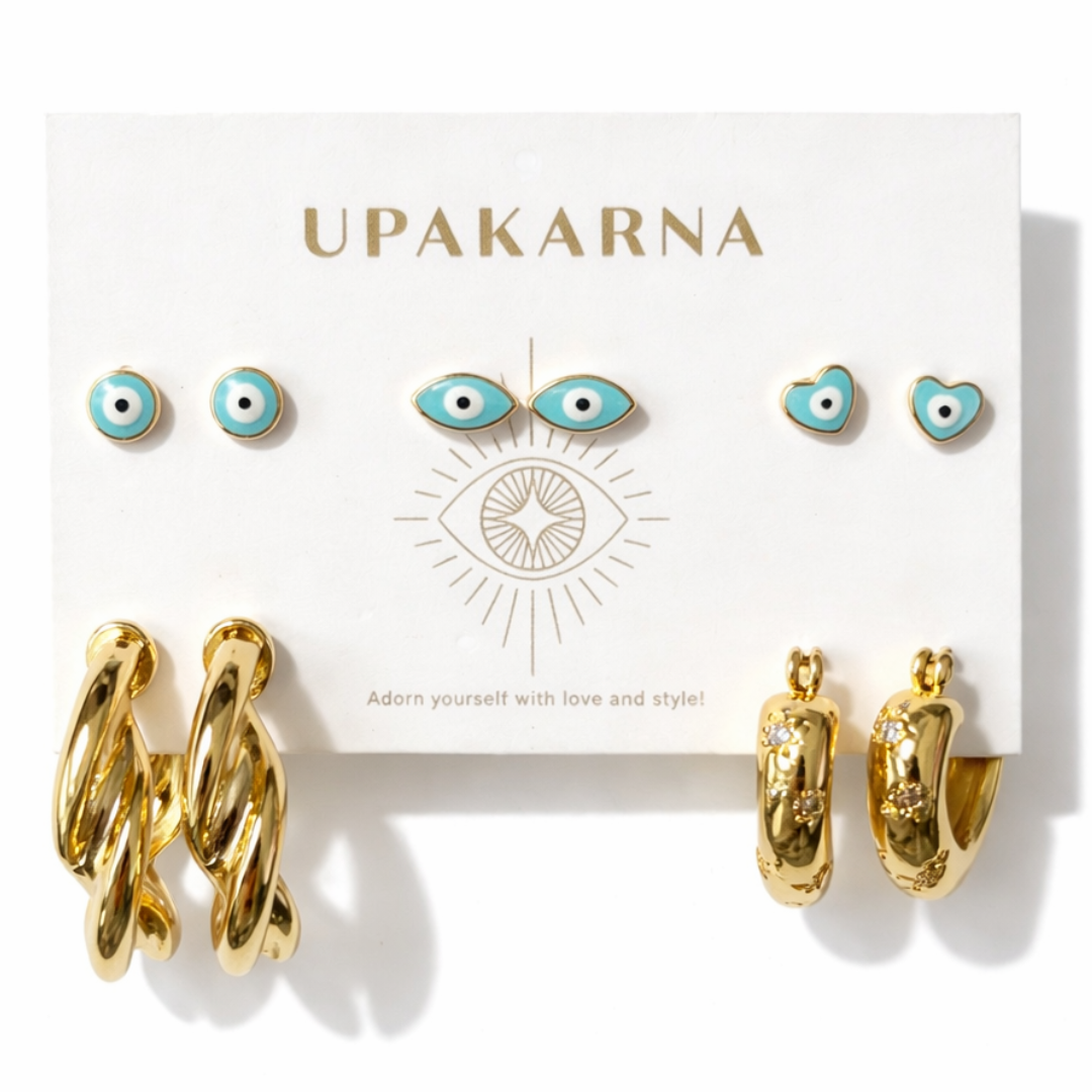 gold evil eye earring stack with enamel evil eye studs, twisted hoop earrings and heart hoop earrings trendy lightweight jewellery