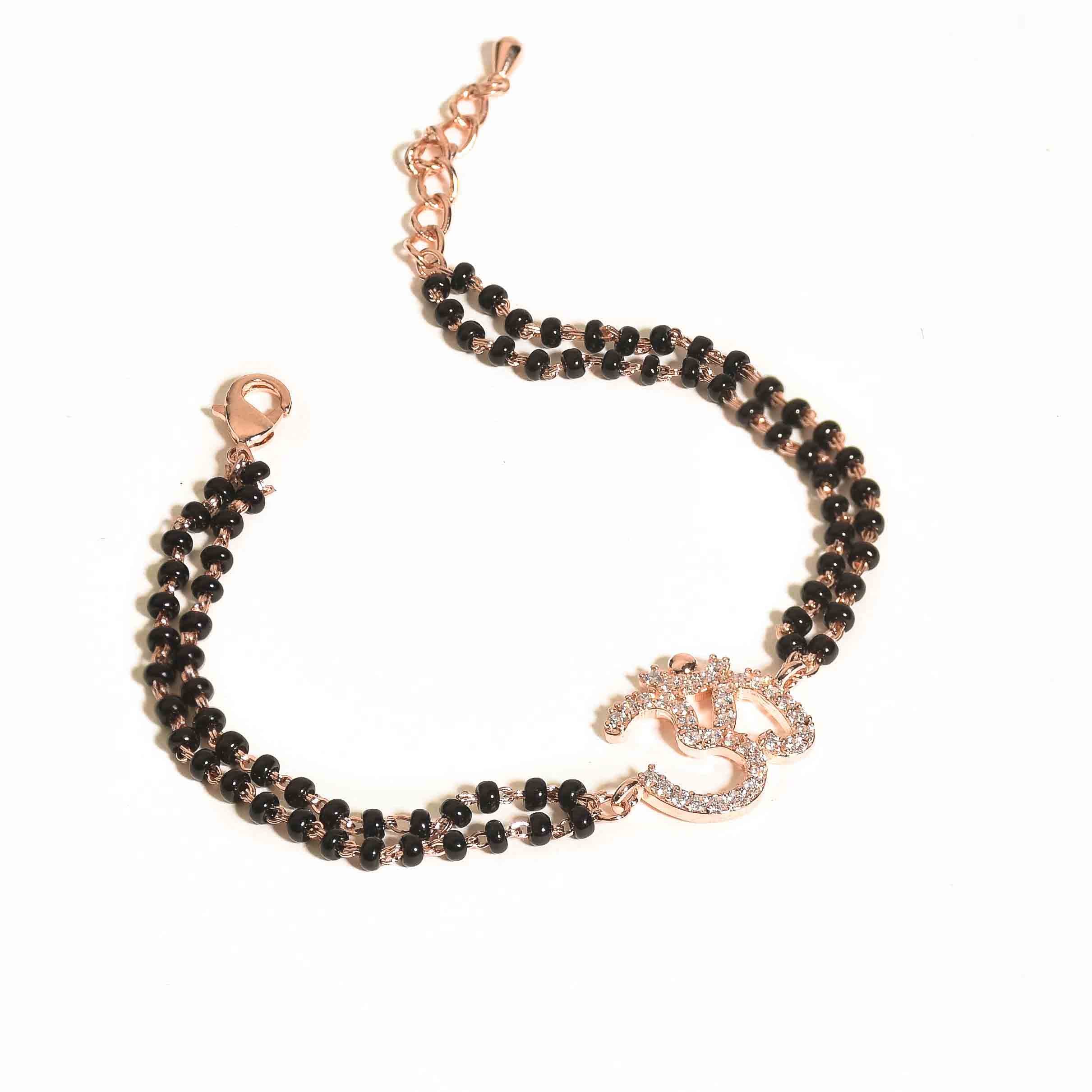 Om mangalsutra bracelet with a sacred Om motif and an anti-tarnish finish, available in gold and rose gold, perfect for everyday wear and meaningful styling.