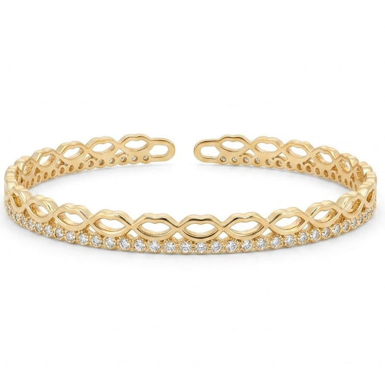 Elegant gold-tone adjustable open cuff bangle featuring an intricate infinity-inspired openwork design with a row of sparkling pavé crystals along the front. The lightweight anti-tarnish bangle has a polished finish and is displayed on a clean white background, making it perfect for everyday wear, stacking, gifting, and special occasions.