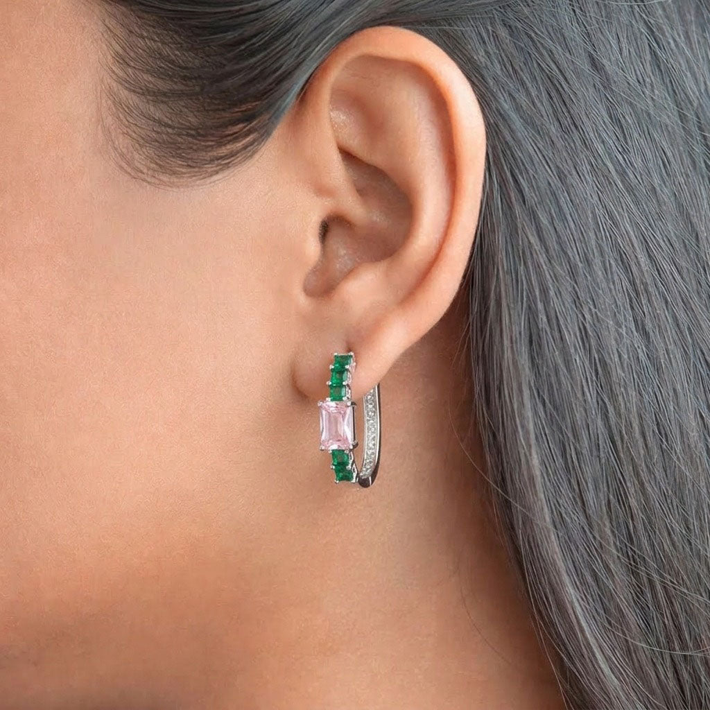 Prism Grace 925 Sterling Silver Earrings available in two vibrant colorways—blush pink with emerald green accents and yellow with purple accents—featuring a rectangular center stone, baguette-cut side stones, and a sleek curved sterling silver hoop with pave detailing